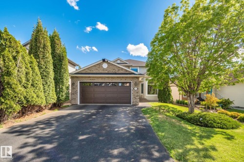 Exterior brick façade with an integrated two-car garage - 591 Byrne Crescent, Edmonton, AB 