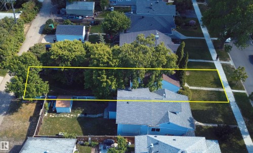 Rectangular parcel featuring mature trees and a grassed area - 11417 65 Street, Edmonton, AB 
