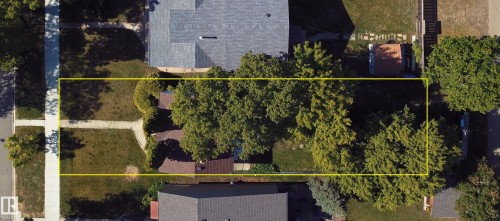 Spacious lot featuring mature trees, a defined property boundary, and established residential surroundings - 11417 65 Street, Edmonton, AB 