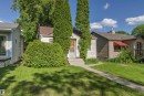 Single-story residence featuring light-colored siding and a contrasting brown roof - 11417 65 Street, Edmonton, AB 