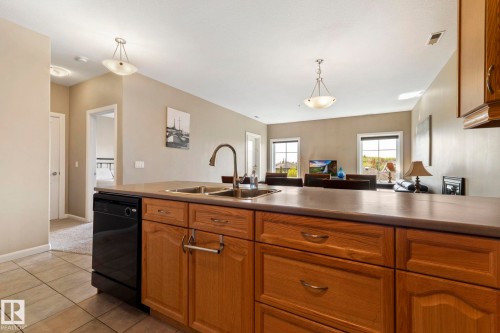 430 160 Magrath Road, Edmonton, AB - Indoor Photo Showing Kitchen With Double Sink