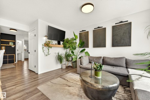 Living space featuring wood-finish flooring, white walls, and recessed lighting - 20507 128 Avenue, Edmonton, AB 