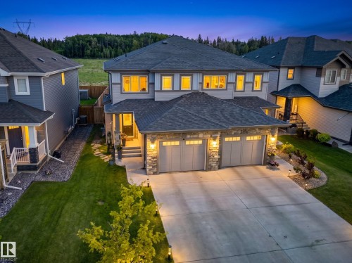 Two-story residential exterior with a stone and siding facade - 20507 128 Avenue, Edmonton, AB 