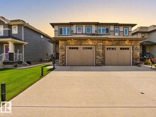 Two-story residence featuring a stone and siding exterior facade - 20507 128 Avenue, Edmonton, AB 