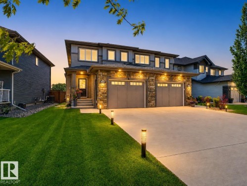Contemporary two-story residence featuring a stone and siding exterior - 20507 128 Avenue, Edmonton, AB 