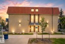 Contemporary exterior with stucco finish and a distinctive red metal roofline - 204 12404 114 Avenue, Edmonton, AB  - Outdoor 