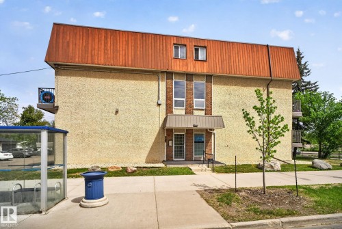 Multi-story building featuring a stucco exterior and a sloped roofline - 204 12404 114 Avenue, Edmonton, AB - Outdoor