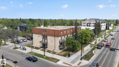 Multi-story building featuring brick and paneling exterior - 204 12404 114 Avenue, Edmonton, AB - Outdoor With View