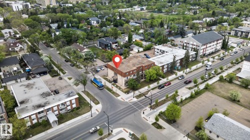 Aerial perspective showcasing a multi-story building at a street intersection - 204 12404 114 Avenue, Edmonton, AB - Outdoor With View