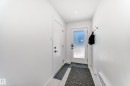 Entryway featuring a frosted glass panel door, recessed ceiling lighting, and a baseboard heater - 46 1304 Rutherford Road, Edmonton, AB  - Indoor Photo Showing Other Room 