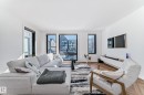 Bright living area featuring expansive windows, recessed lighting, and herringbone wood-finish flooring - 46 1304 Rutherford Road, Edmonton, AB  - Indoor Photo Showing Living Room 