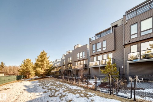 Contemporary townhome exterior featuring multi-level design and a private yard - 46 1304 Rutherford Road, Edmonton, AB - Outdoor