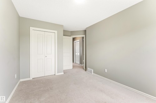 Neutral wall paint, light-toned carpeting, and white trim - 8204 180 Avenue, Edmonton, AB 