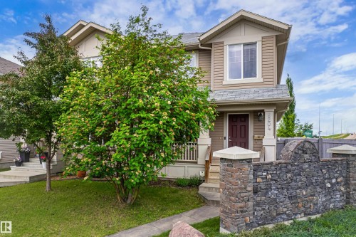 Two-story residence featuring siding and shingle accents - 8204 180 Avenue, Edmonton, AB 
