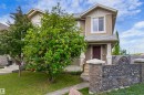 Two-story residence featuring siding and shingle accents - 8204 180 Avenue, Edmonton, AB 