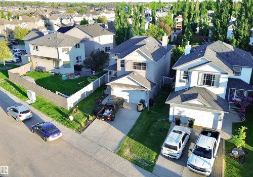 Residential property with an attached garage and paved driveway - 105 Greystone Crescent, Spruce Grove, AB 