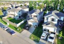 Residential property with an attached garage and paved driveway - 105 Greystone Crescent, Spruce Grove, AB 