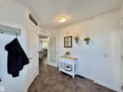 Entryway featuring tile flooring, a frosted glass interior door, and a flush-mount ceiling light fixture - 