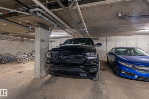 Dedicated parking space within a concrete subterranean garage - 107 142 Ebbers Boulevard, Edmonton, AB 