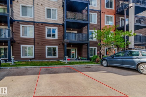 Paved parking space with red outlined boundaries - 107 142 Ebbers Boulevard, Edmonton, AB 