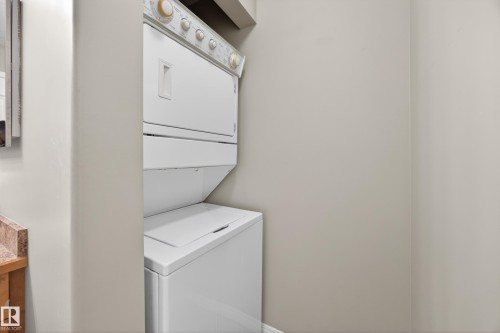 Stacked washer and dryer unit within a dedicated alcove - 111 3425 19, Edmonton, AB 