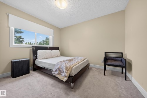 Bright bedroom with neutral wall tones and a white window frame - 34 Grand Meadow Crescent, Edmonton, AB 