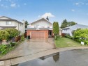 Two-story residence featuring a brick facade and a second-level balcony - 34 Grand Meadow Crescent, Edmonton, AB 