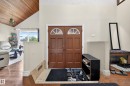 Double entry doors with arched transom windows and a tiled entryway - 34 Grand Meadow Crescent, Edmonton, AB 