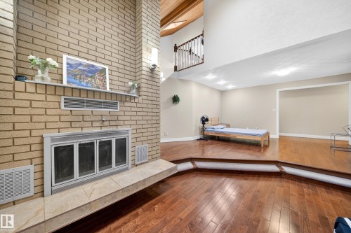 Brick fireplace with a tiled hearth - 34 Grand Meadow Crescent, Edmonton, AB 