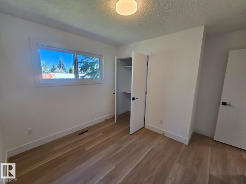 Room featuring light wood-finish flooring and white baseboards - 18526 86A Avenue, Edmonton, AB - Indoor Photo Showing Other Room