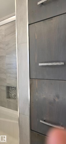 Grey wood-finish cabinetry with decorative pulls - 6704 93 Street, Edmonton, AB 