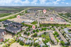 Aerial perspective showcasing residential properties and commercial developments - 