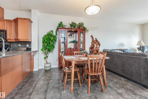 Open-concept living area with gray tile flooring - 439 300 Palisades Way, Sherwood Park, AB - Indoor Photo Showing Other Room