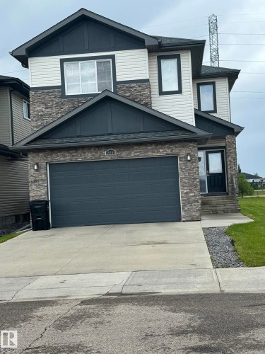 Two-story residence featuring a stone veneer and siding facade - 15168 16 Street Nw, Edmonton, AB 