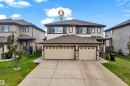 Two-story residence featuring a two-car attached garage with individual doors - 1532 33B Street, Edmonton, AB 