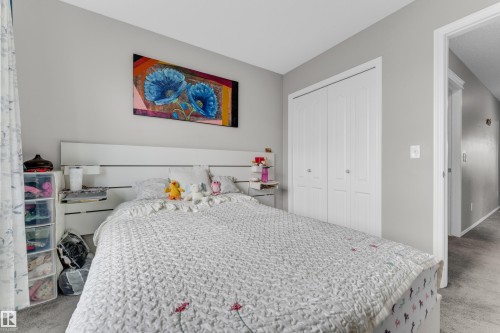 Bedroom featuring light grey wall paint and grey carpet flooring - 1532 33B Street, Edmonton, AB 