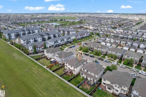 Aerial depiction of a residential development featuring single-family homes and multi-unit buildings - 1532 33B Street, Edmonton, AB 