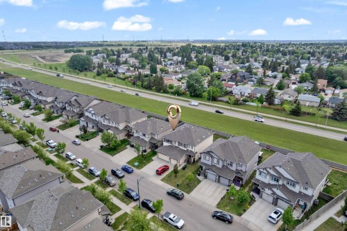 Aerial perspective showcasing a residential neighborhood with detached homes and townhouses - 1532 33B Street, Edmonton, AB 