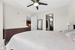 Bedroom featuring a contemporary ceiling fan with integrated lighting, neutral wall tones, and recessed lighting - 