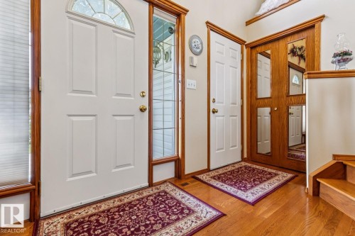 Entryway featuring warm wood-finish flooring - 5131 152A Avenue, Edmonton, AB 