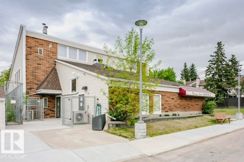 Two-story building featuring a brick and siding exterior with a pitched roof - 71 11255 31 Avenue, Edmonton, AB - Outdoor