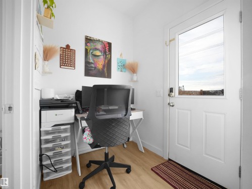 Dedicated workspace featuring wood-finish flooring and bright white walls - 19316 29 Avenue, Edmonton, AB 
