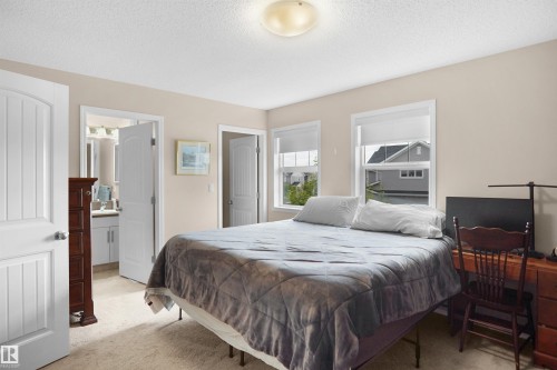 Carpeted room with a ceiling-mounted light fixture - 292 Simmonds Way, Leduc, AB 