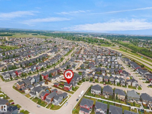 Aerial perspective showcasing a residential neighborhood with varied architectural styles - 292 Simmonds Way, Leduc, AB 