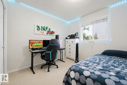 Windowed room featuring light-toned walls and carpet flooring - 1804 121 Street, Edmonton, AB 