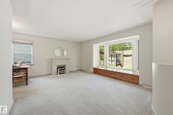 living room with large bay window finished with hardwood seating area - 
