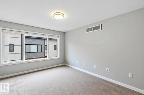 AI Decluttered -Spacious room featuring neutral carpeting and light gray walls - 33 1729 Keene Crescent, Edmonton, AB 