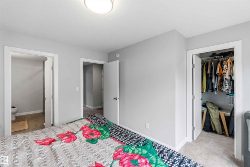 Room featuring light gray walls, white trim, and light-colored carpet flooring - 33 1729 Keene Crescent, Edmonton, AB 