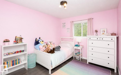 Interior room featuring pink walls and dark wood-finish flooring - 209 5128 Highway 18, Rural Barrhead County, AB 