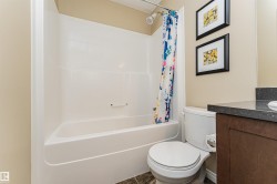 White shower-over-tub combination with a chrome shower head - 